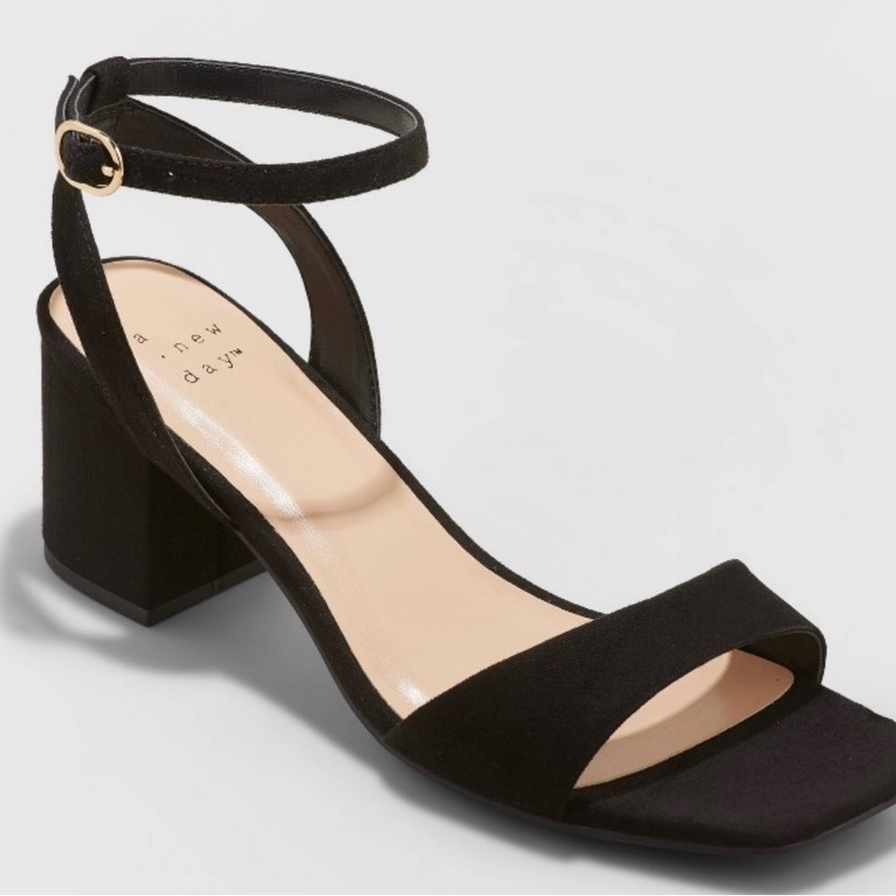 Black heels, modest heel, good condition.